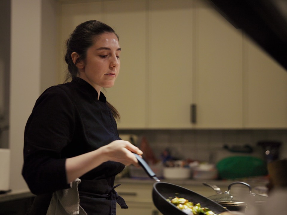 A private chef cooking at the stove in the house