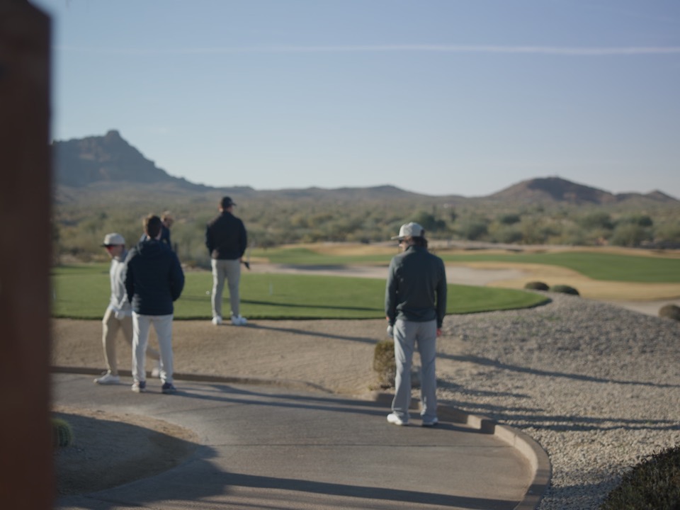 The crew walking in past the We-Ko-Pa Cholla course sign